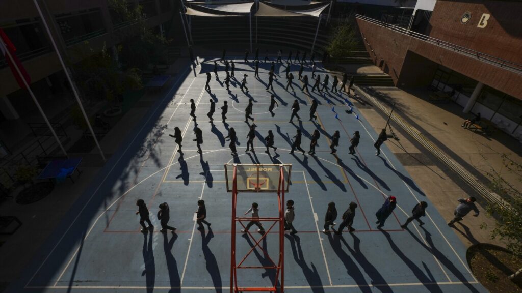 Chilean school blocking mobile phones, teens hug basketball and ping pong